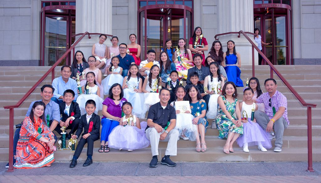 A group of Little Chopin competition winners posing on the front steps of the 2019 Carmel Klavier International Piano Competition